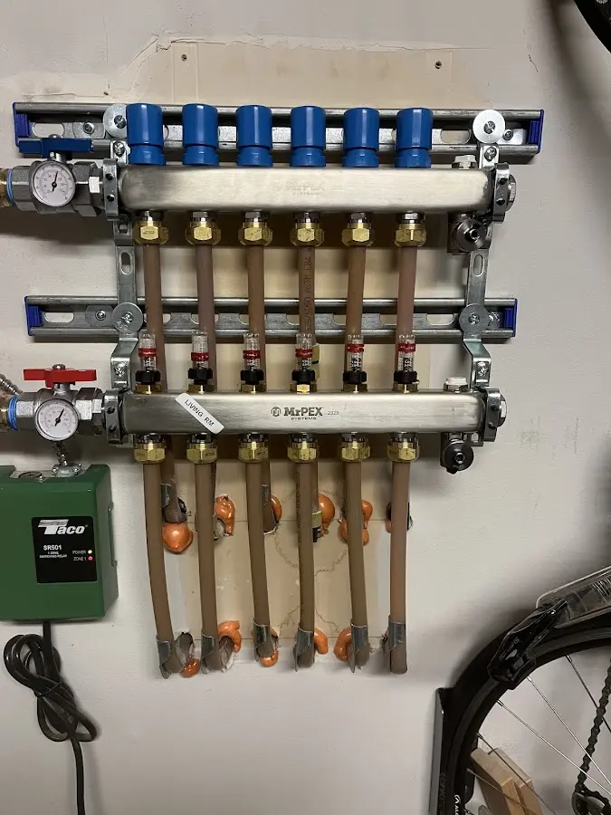 Plumber performing Water Heater Repair at a residential property in El Campo